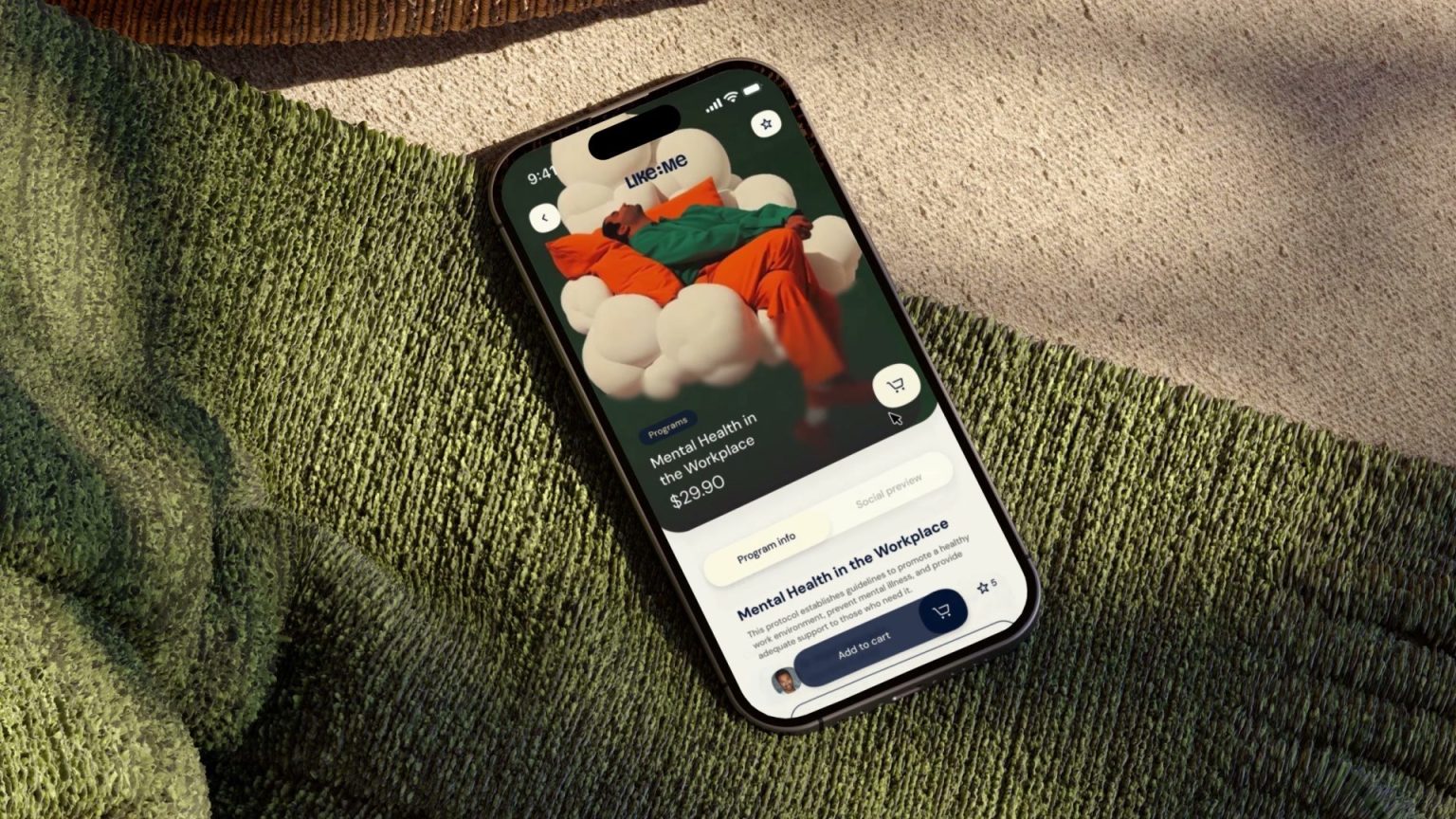 Celular sobre tecido de malha com a tela do programa Mental Health in the Workplace, com a imagem de uma pessoa sobre nuvens